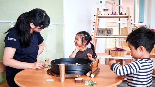 two children playing with educator @ Guardian Parramatta