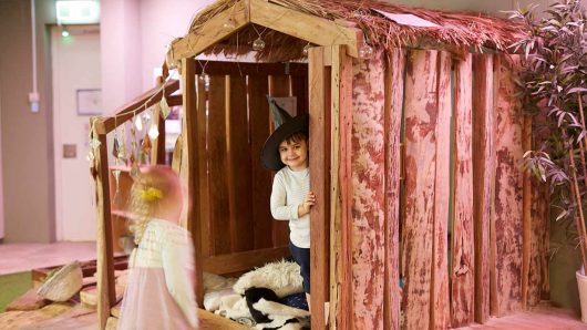 Children from George St playing in cubby house