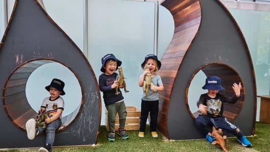 Children playing in outdoor interactive area at Guardian Margaret street