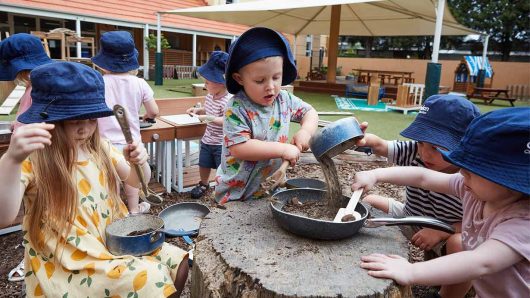 Children playing with cooking equipment at Balmain Cove