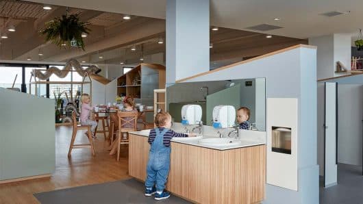 Children washing hands and eating inside Taringa