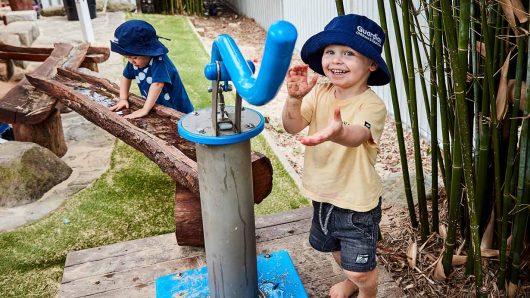 Children playing with water feature at Freshwater