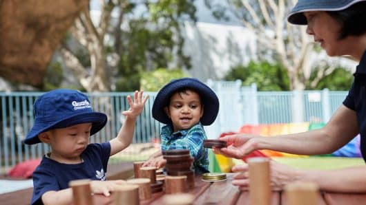 Children interacting with Educator outside at Pymble