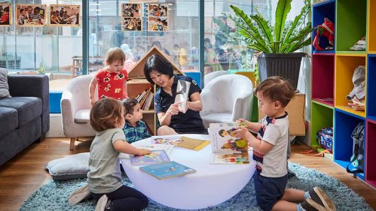 Children reading with Educator at Pymble