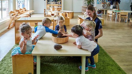 Children interacting inside with Educator at Wahroonga
