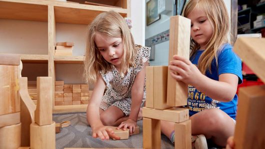 Two children playing with blocks indoor at Lilyfield