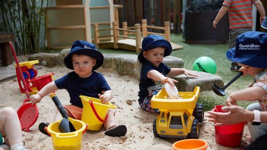 Two children playing in sandpit at Lilyfield